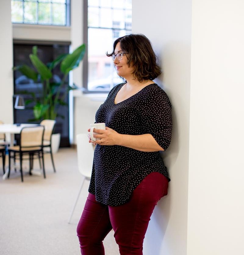 Plus size woman sitting smiling